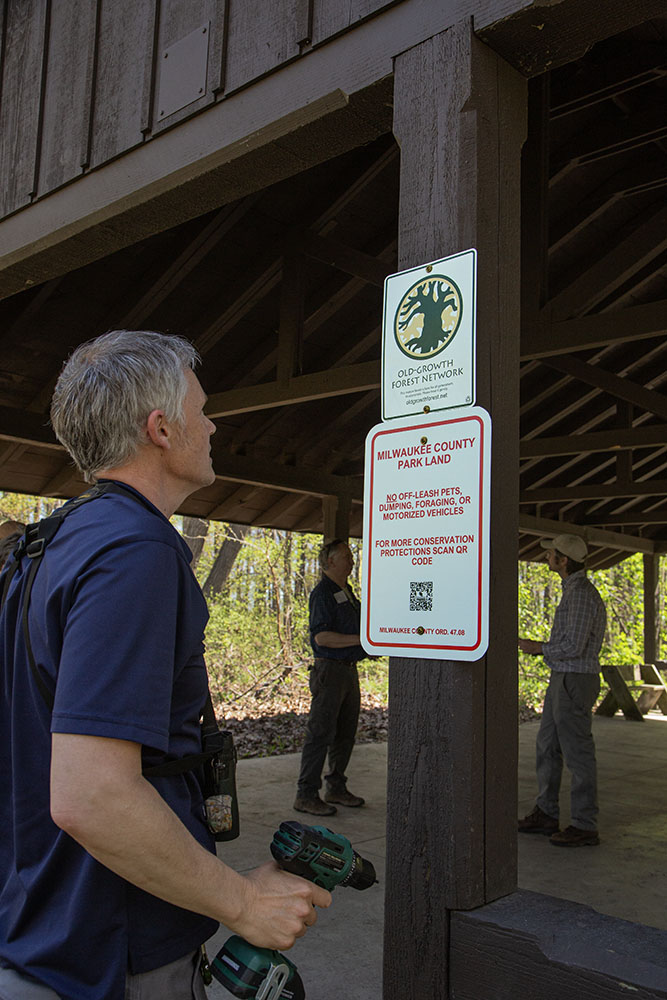 Following the tour Russart promptly attached the new sign on the shelter at the trailhead.