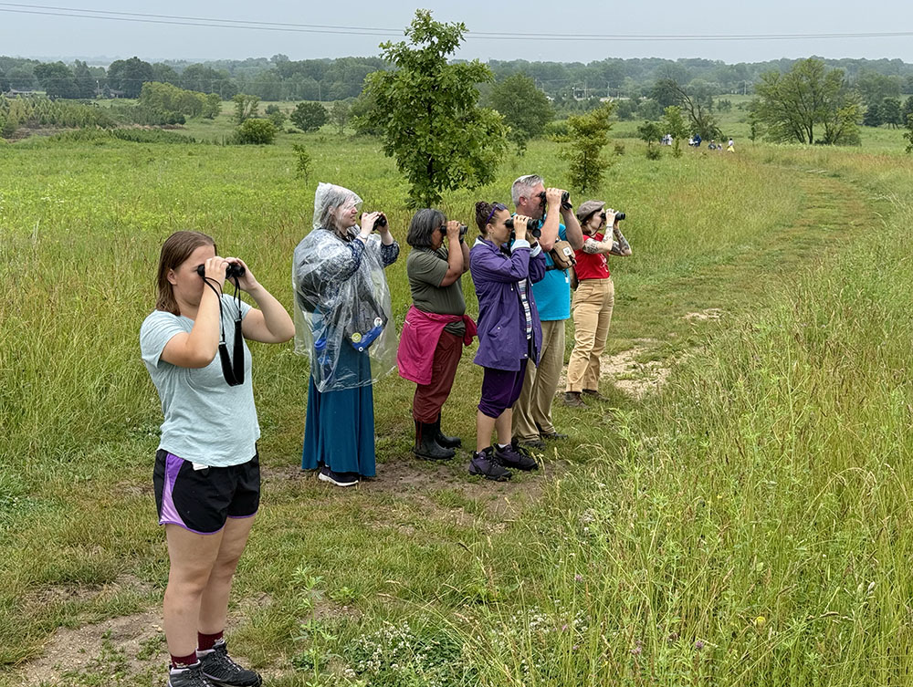 Birders in action! A guided tour led by Rita Flores Wiskowski (third from left).