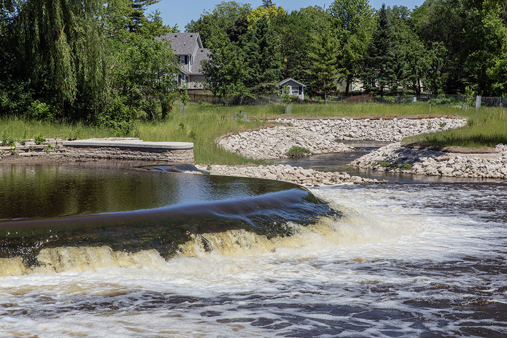 Kletzsch Park Dam and the mouth of the new fish passage in June, 2024.