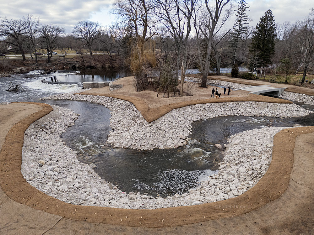 The fish passage is designed with gentle rapids alternating with calm pools that allow native fish that can't jump the falls at the dam to swim upstream against the current. 2023.