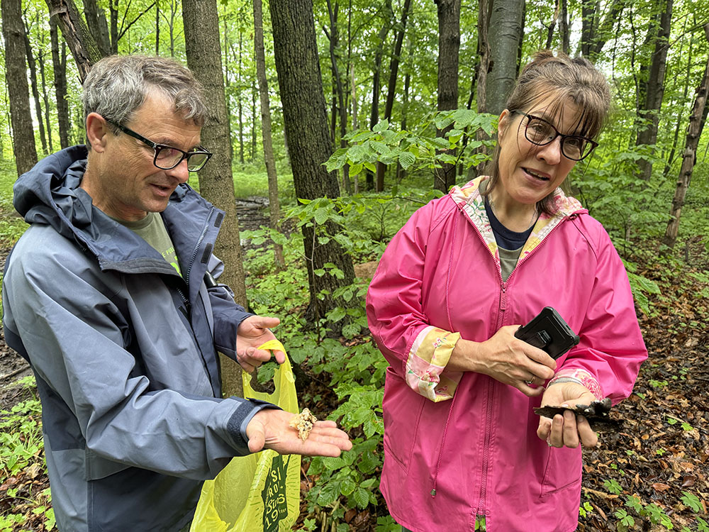 LeRoy and Anne Gehring holding up part of their catch: Jelly Fungus (left) and Dead Man's Fingers (right).