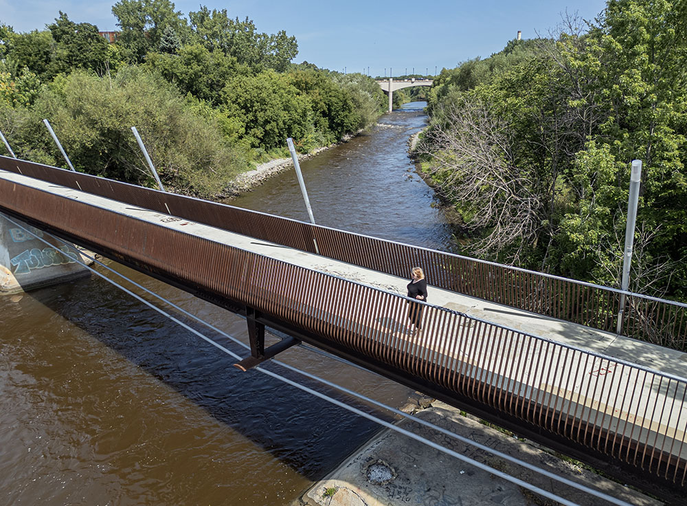 Clare Jorgensen on the pedestrian bridge atop the former North Avenue Dam.