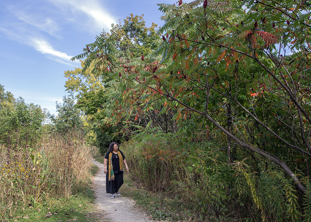 Dara Larson walking a trail in Turtle Park.