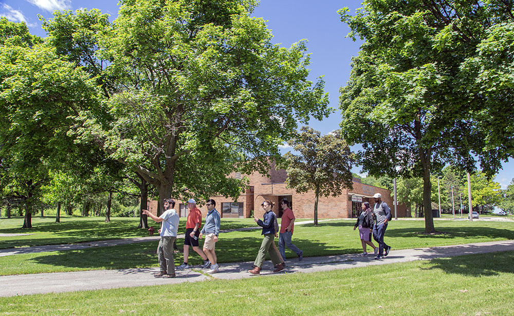 The group walks past the Noyes Park Indoor Pool.