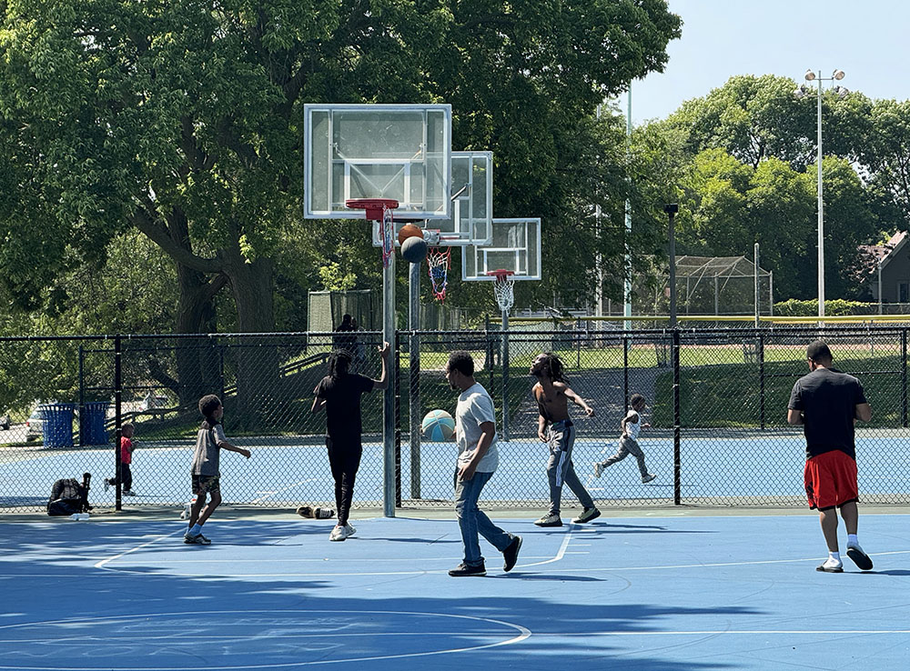 Basketball courts are well used by all ages. ED