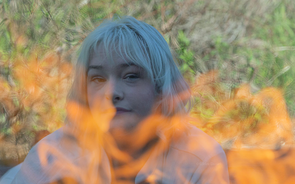 Ally Wilber and flames at Forest Beach Migratory Preserve.