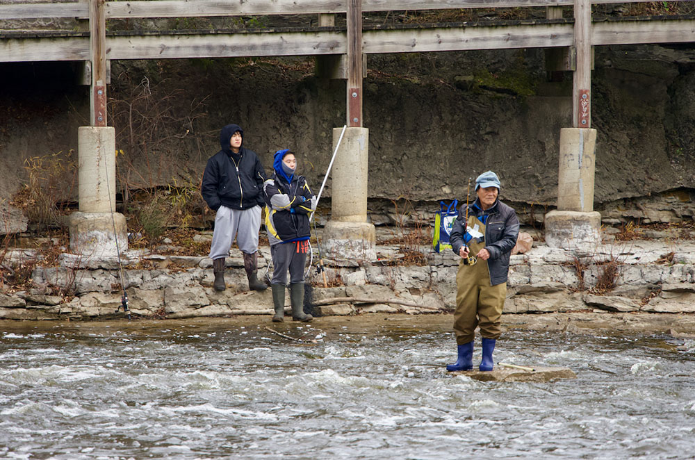 Multigenerational anglers near the falls.