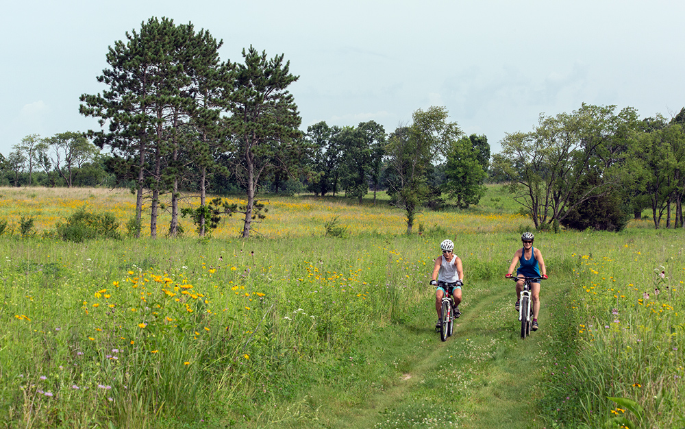 Cyclists on the Prairie Path in the Schoeninger Savannah section of Lapham Peak.