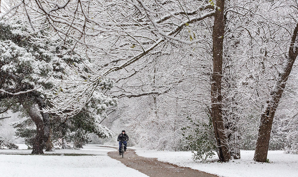 Cycling in the snow on the Oak Leaf Trail.