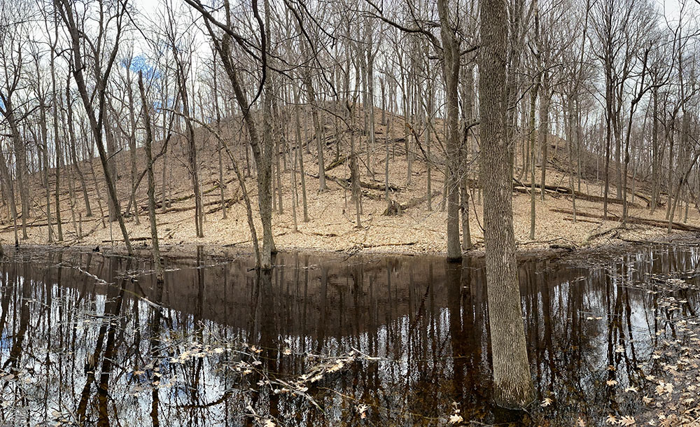The Cedar Lakes Segment of the Ice Age Trail runs through the Polk Kames Kettle Hills Nature Preserve near Slinger, Washington County. Polk Kames has one of the highest concentrations of kames, the glacial hill shown here, in the world.