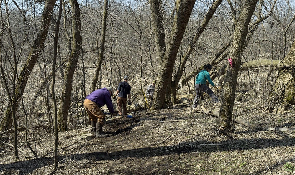 Volunteers and Tall Pines Conservancy staff working on a new trail at Saeger Creek Preserve