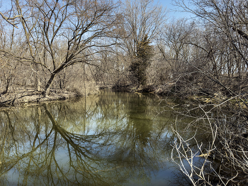 The new trail will stretch around this scenic pond.