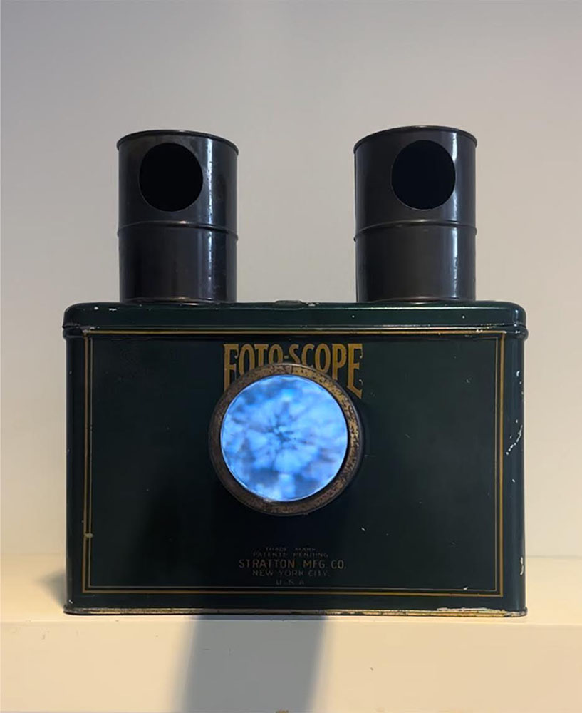 Single channel video loop of the Milwaukee River inside a 1905 Stratton Foto-Scope Postcard Projector, 2025.