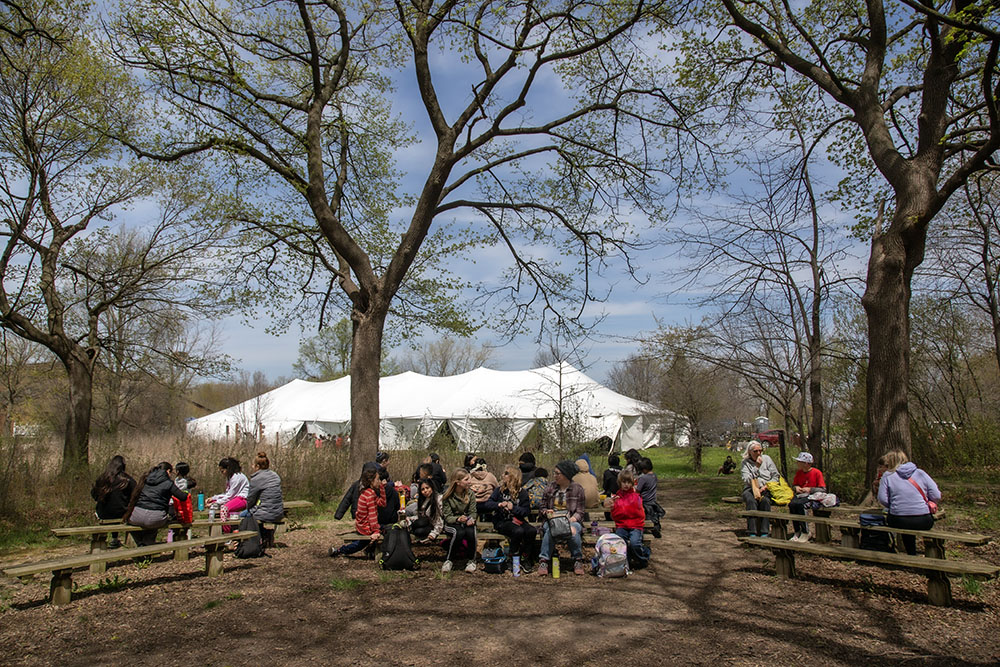 This being middle school, lunch was an important part of the day's scheduled activities! While most ate lunch in the large tent (background), this group opted for the outdoor classroom in a wooded grove.