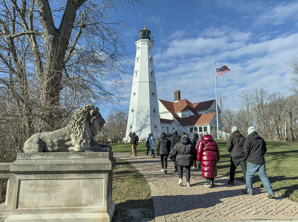 North Point Lighthouse and one of the lions that grace the ends of the ravine bridges in Lake Park, which was designed by Frederick Law Olmsted.