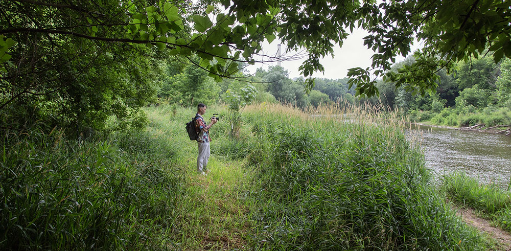 Artist in Residence Zhiwan Cheung in the Milwaukee River Greenway