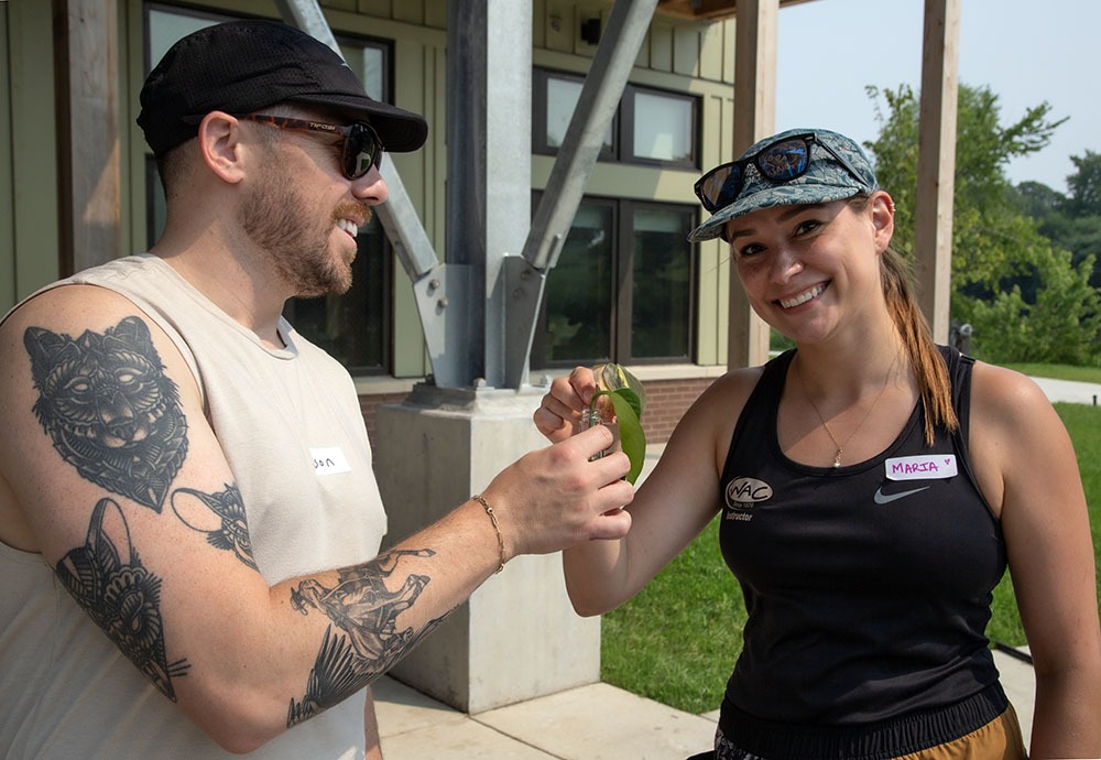 Participants Wilson and Maria with their house plant cuttings.