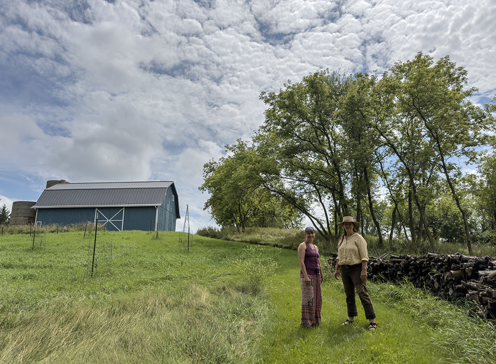 Becky Fedak, Executive Director of Tall Pines Conservancy, with Rachel Catlett (right) at Pearl Forge Farm.