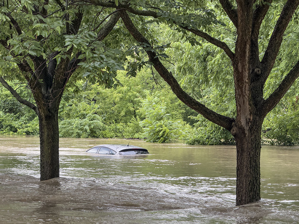 Flooded car on the Menomonee River Parkway in Wauwatosa.