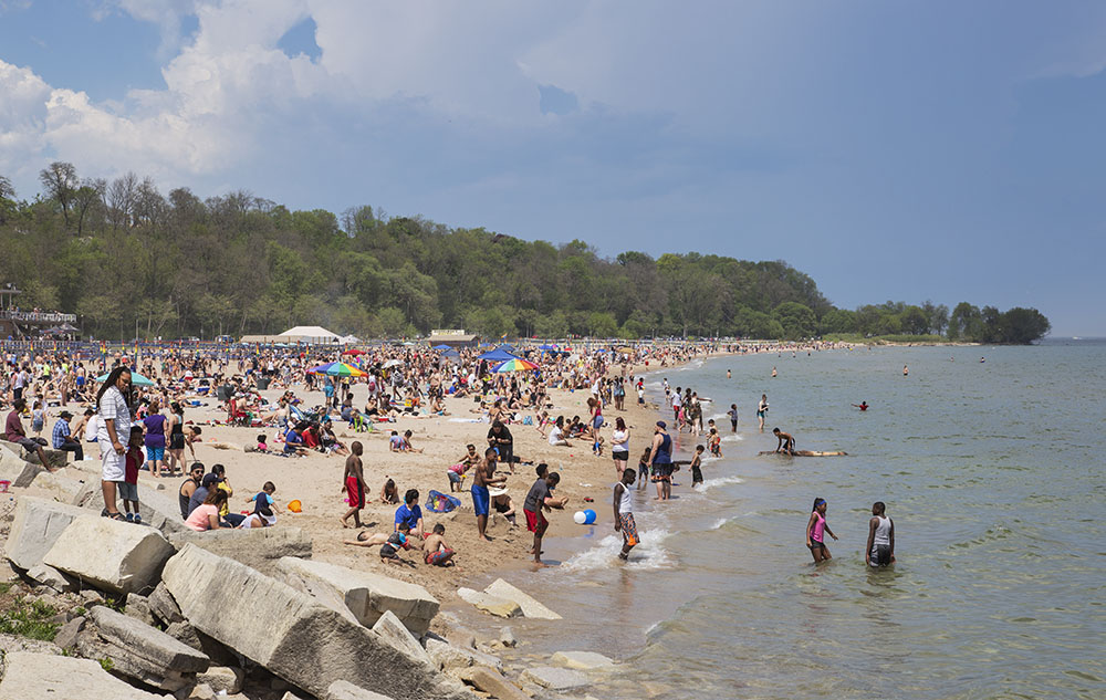 Milwaukee County Parks' beaches can provide communal experiences, such as this Memorial Day weekend scene at Bradford Beach on Milwaukee's downtown Lakefront.