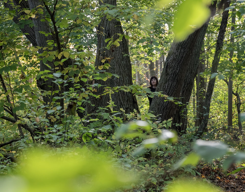 The artist in a hardwood forest, one of the vital habitats for wildlife.