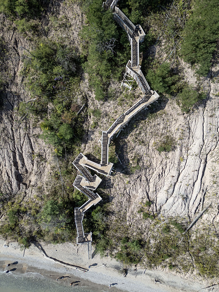 A vertiginous view of the "Floating Stairway" from blufftop to beach.
