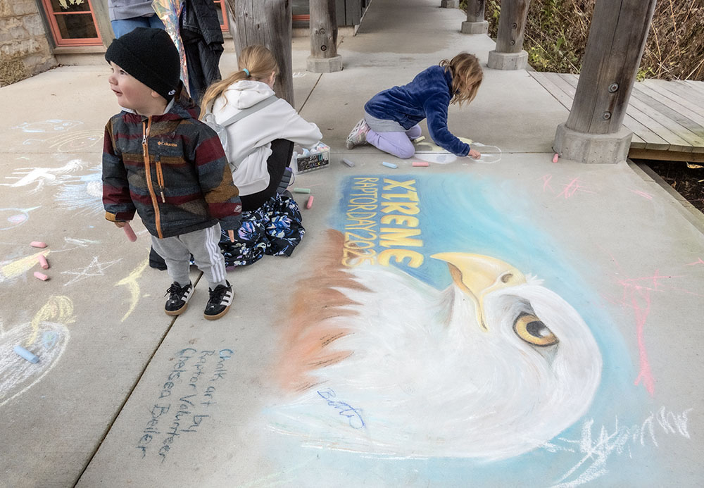 A chalk-drawing station outside the education center.