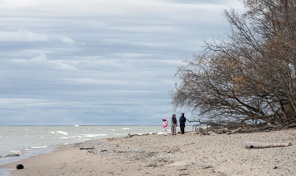 A trio of teens find solitude on the beach.