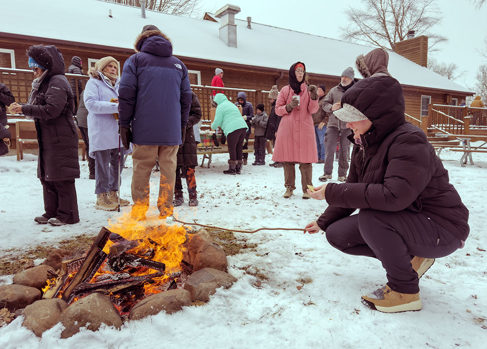 Roasting a marshmallow for a s'more.