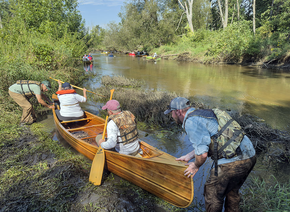 Launching again after the portage. Gotta love the mud!