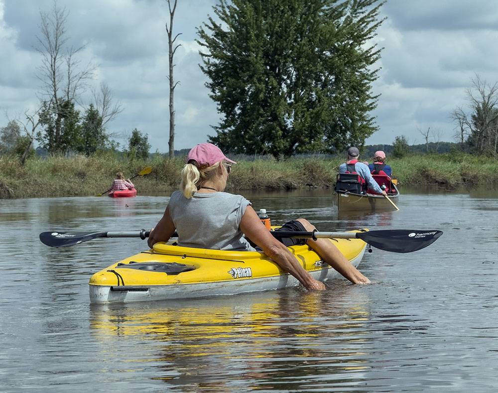 A relaxed kayaker soaking up the sunshine.