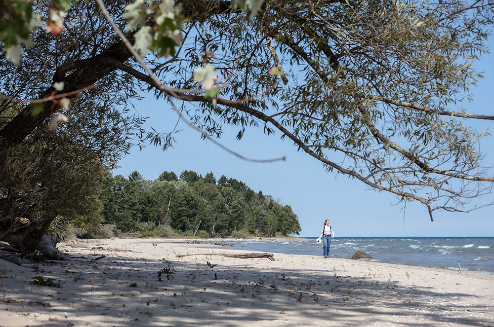 Sheree Wood Sienkiewicz walking the beach at Afterglow Farm
