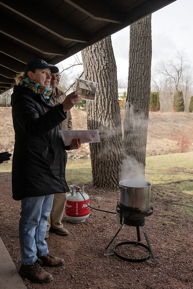 In contrast to the portable setup at the park pavilion, Naturalist Alvey describes the traditional "sugar shack" where the syrup is processed.