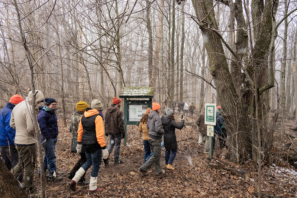 Tour group entering the trailhead at Bratt Woods Nature Preserve.