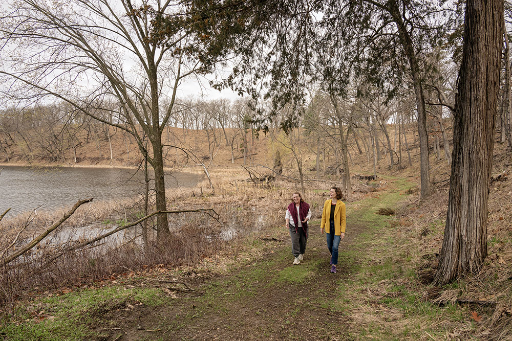 Liesel Lavery and Sarah walking along the Cornell Lake trail.