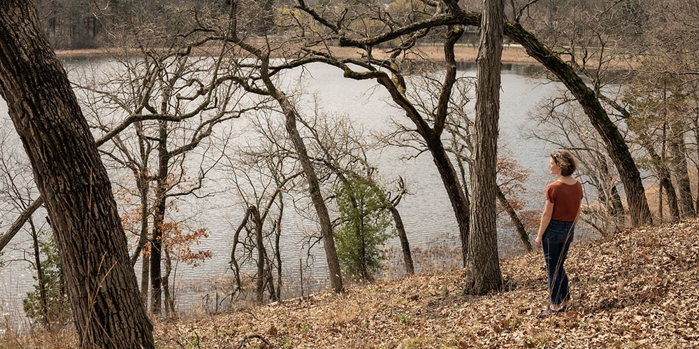 Artist in Residence Sarah Gail Luther at Eschweiler Lavery Conservancy overlooking the lake