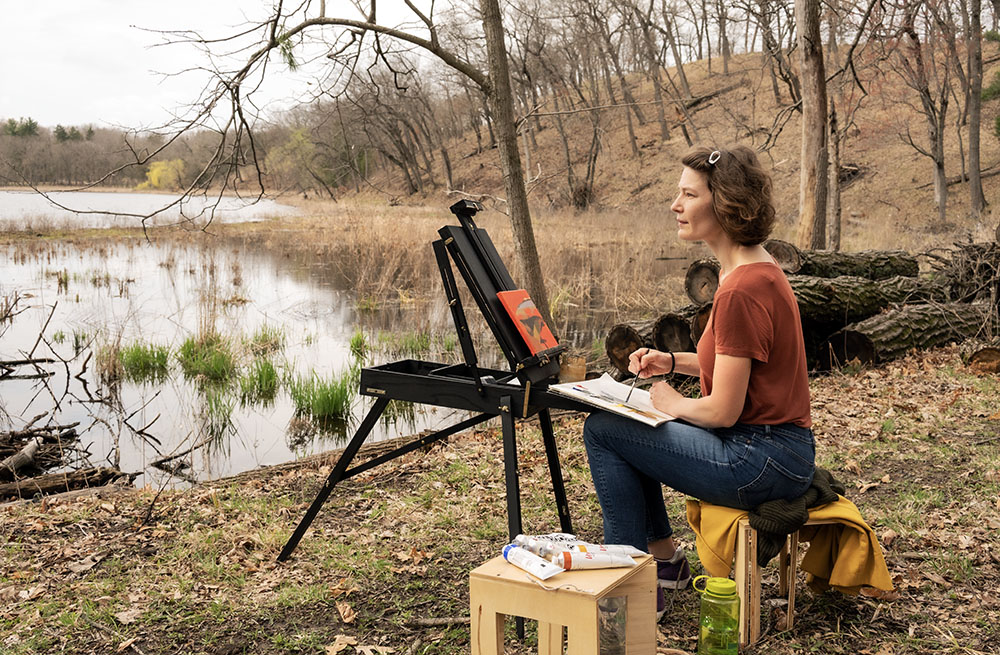 Sarah at her easel beside Cornell Lake. 