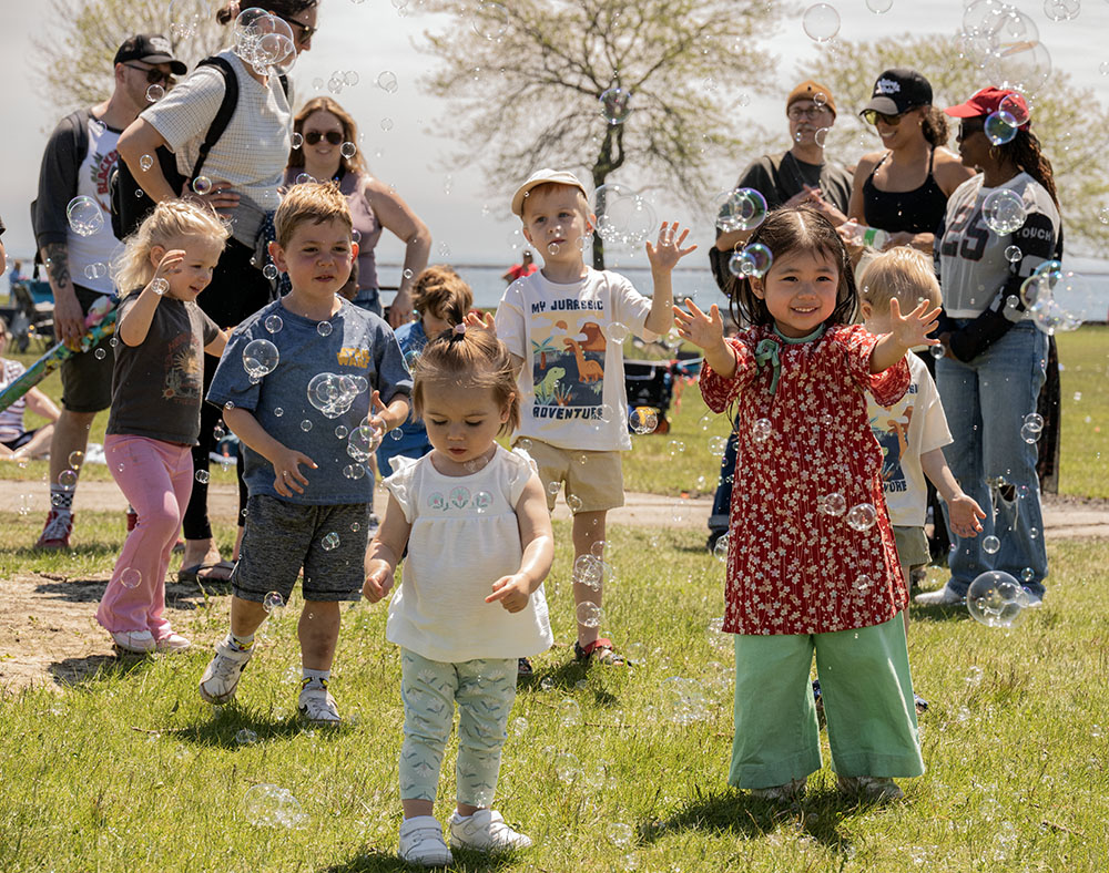 A bubble machine creates a fun diversion for some festival-goers.