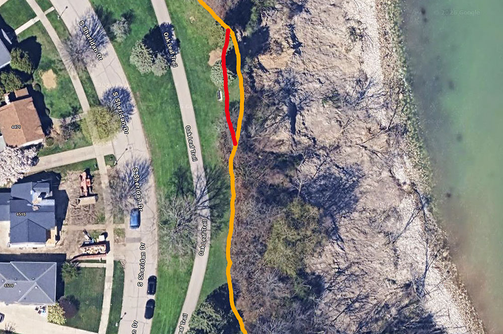 The orange line superimposed onto the aerial view shows the cliff edge in a small portion of Sheridan Park before the recent collapse. The red line indicates the approximate location of the new cliff edge. Image capture from Google Maps.