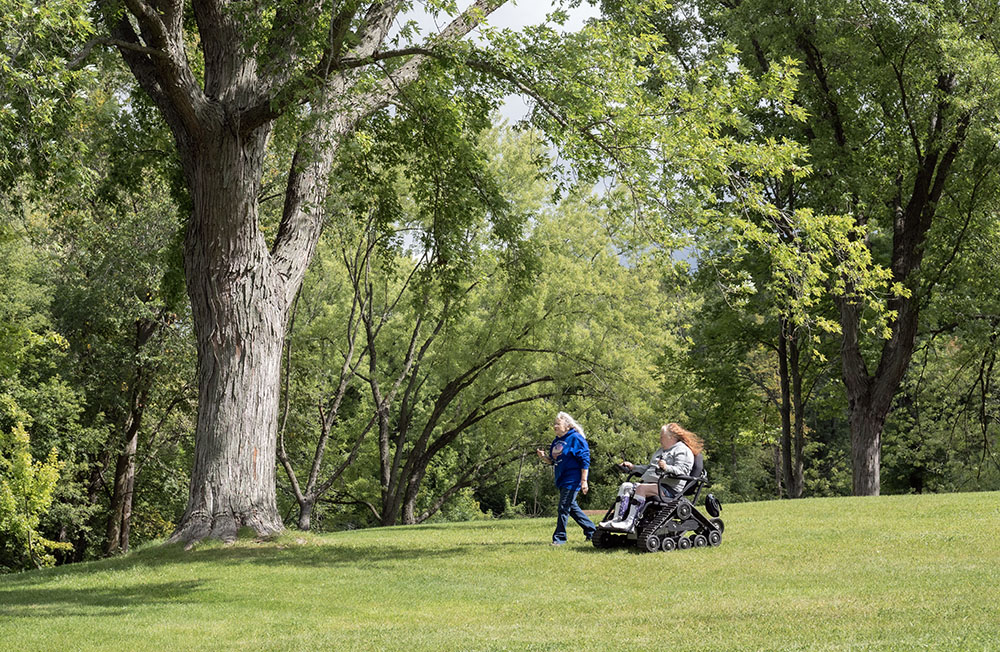 A visitor heads off-trail in one of the all-terrain wheelchairs.