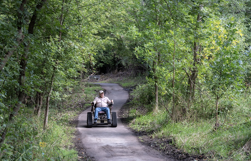 A visitor on the accessible trail loop.