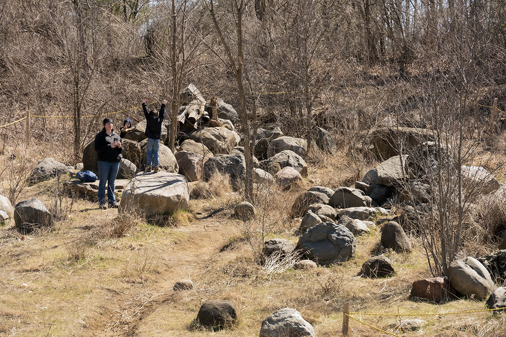 A couple of youngsters prove the value of Larsen's Climbing Rocks, a pile of boulders designed as a natural playground.