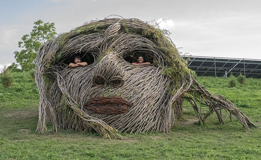 The Walk the Willow team of Justin Roberts and Nathan Kennedy posing inside Sacred Rhythm Mother's head.