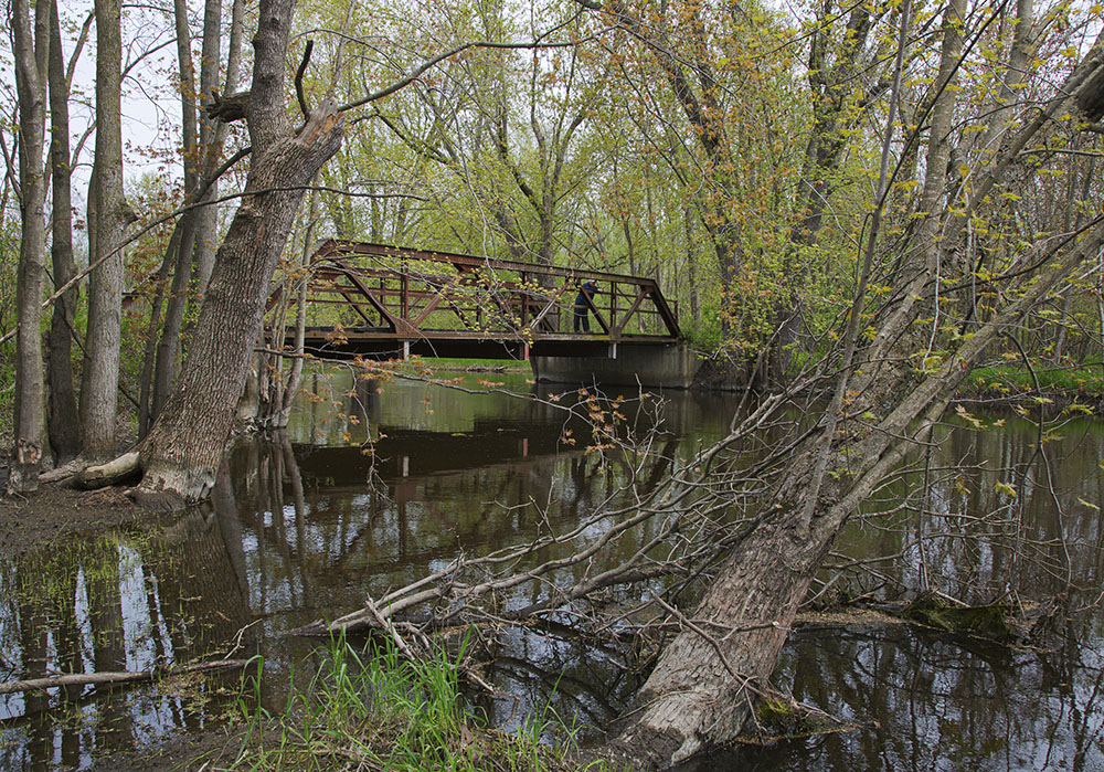 An old farm road bridge crosses the North Branch of the Milwaukee River in the Hoy property in Washington County.