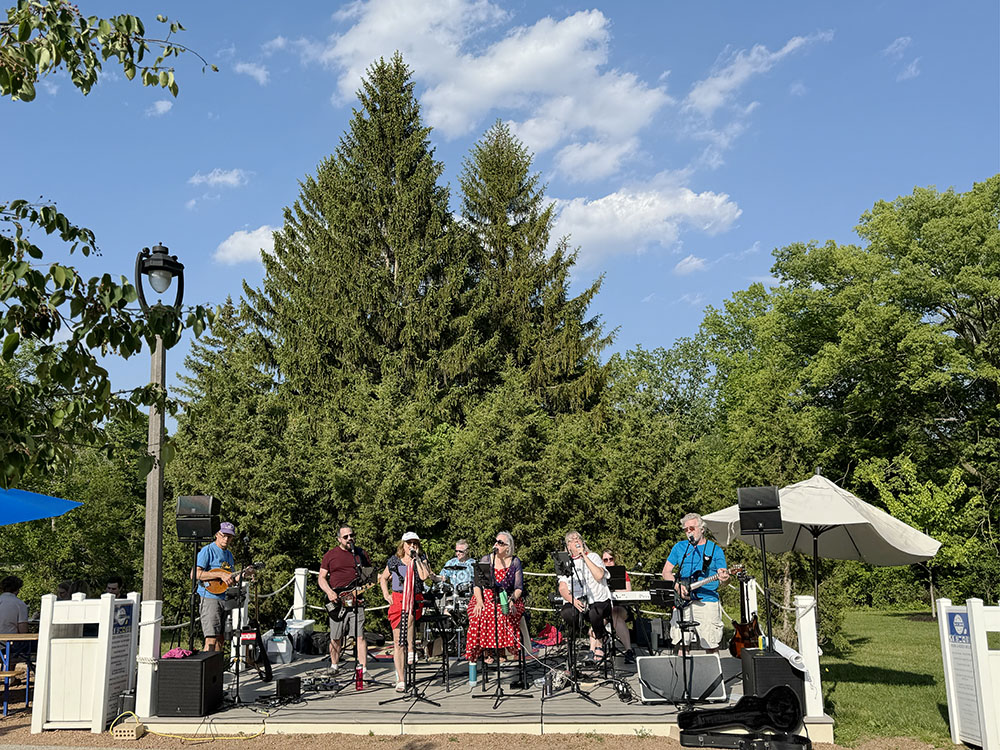 Kaleidoscope, a local band, takes the stage at The Landing, the beer garden in Hoyt Park, Wauwatosa, which is operated by Friends of Hoyt Park & Pool. 