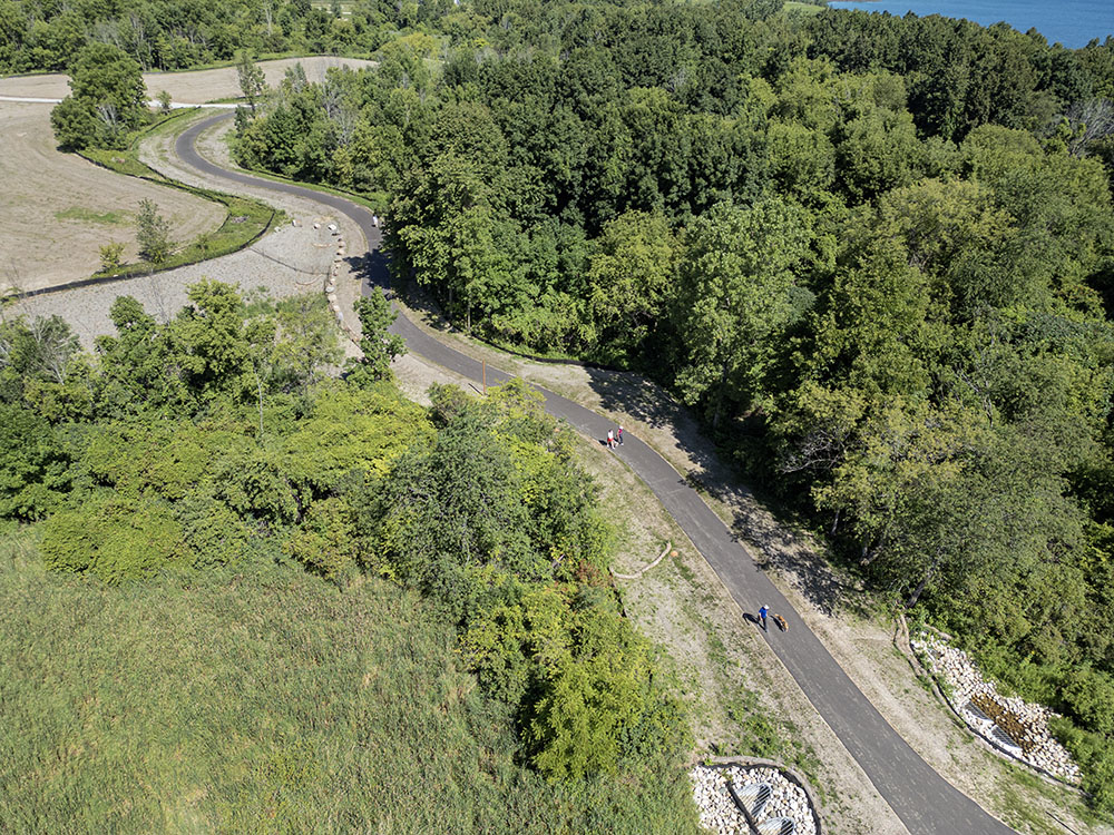 Plenty of people already were out using the new trail, even as work crews continued with finishing touches.