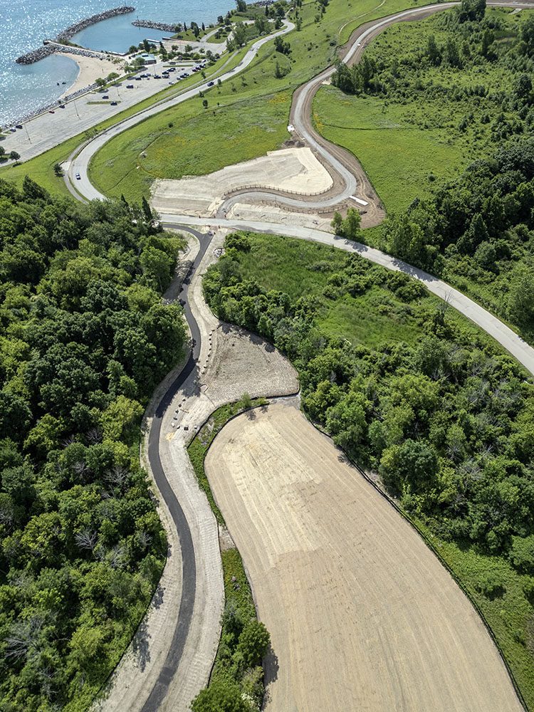 The trail construction project included reclaiming a large dirt parking area (lower right) and restoring it with native vegetation. 