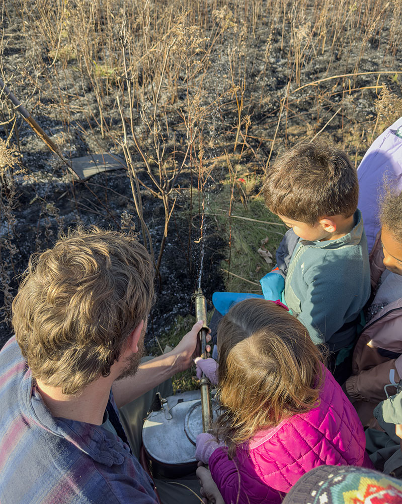 The children were invited to try out the water sprayer.